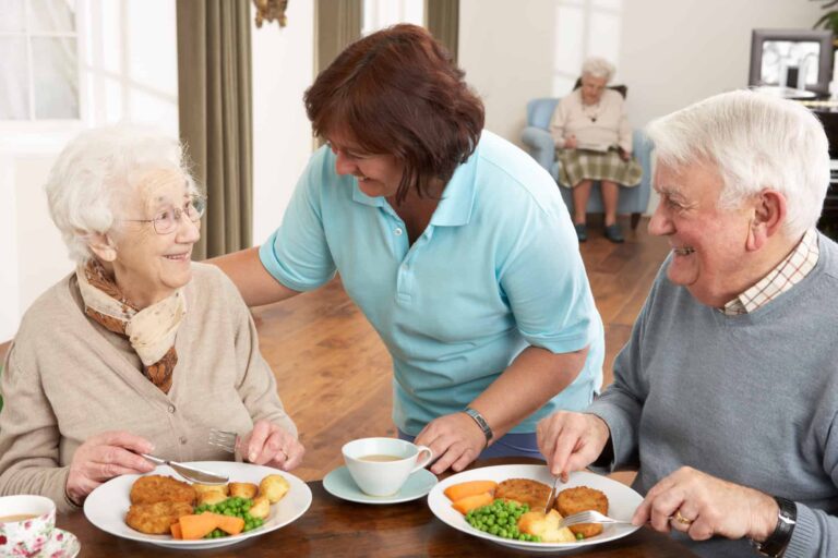 Senior Couple being served meal