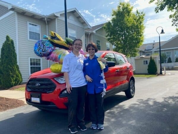 Maricris Cooper, right, is joined by her daughter Colleen Cooper in front of the new Ford Ecosport Maricris won as part of the IntegraCare Continued Attendance Rewards (CAR) Program on Wednesday, May 19, 2021. Photo courtesy of IntegraCare.