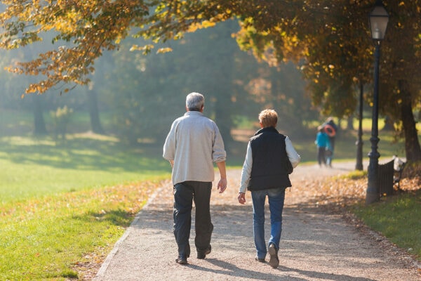 Senior couple walking in park