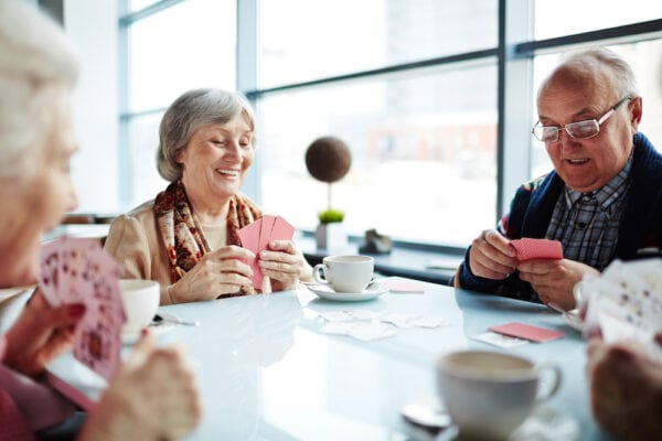 Senior friends playing a card game