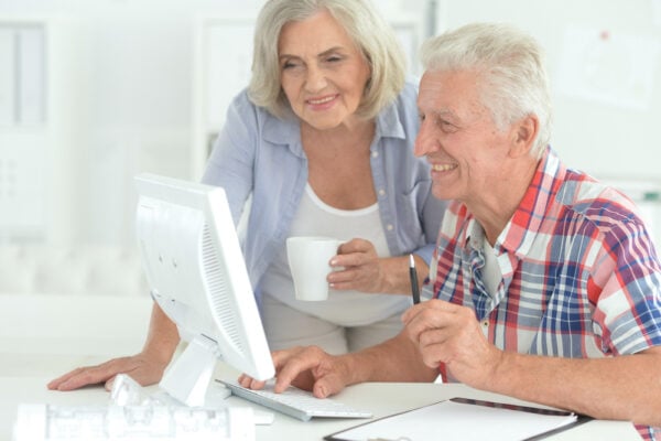 A senior couple reviewing their finances