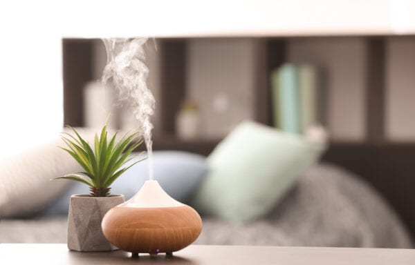 An essential oil diffuser sitting on a table