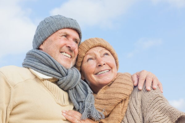 A senior couple going on a walk during winter