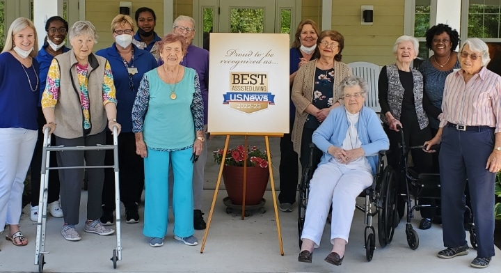 A senior woman and her granddaughter bake together