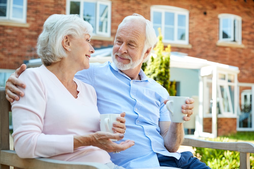 A senior couple enjoys coffee together