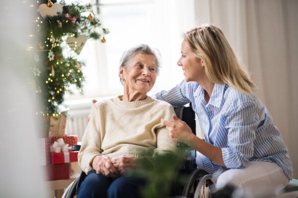 A senior woman and her daughter spend time together during the holidays