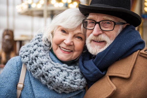 A happy senior couple bundled up for winter