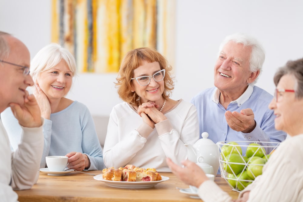 A group of senior friends having brunch together