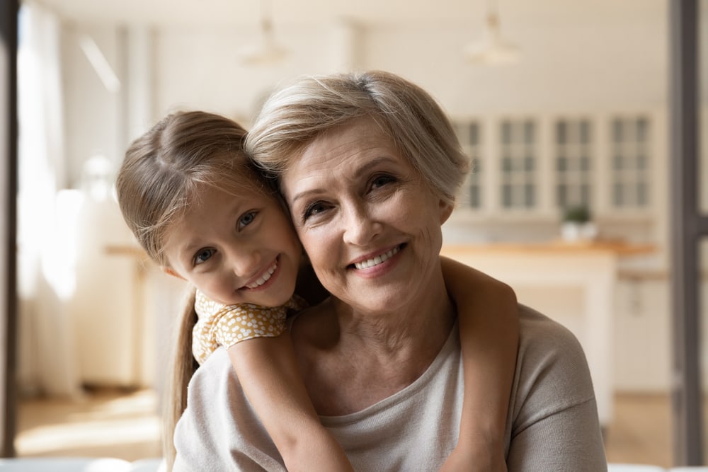 Granddaughter hugging grandma