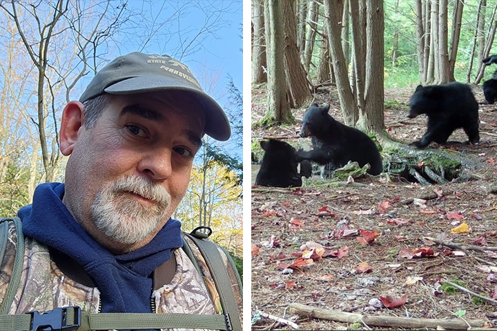 man taking pictures of baby bears