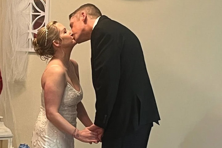 exton-senior-living-wedding-kiss