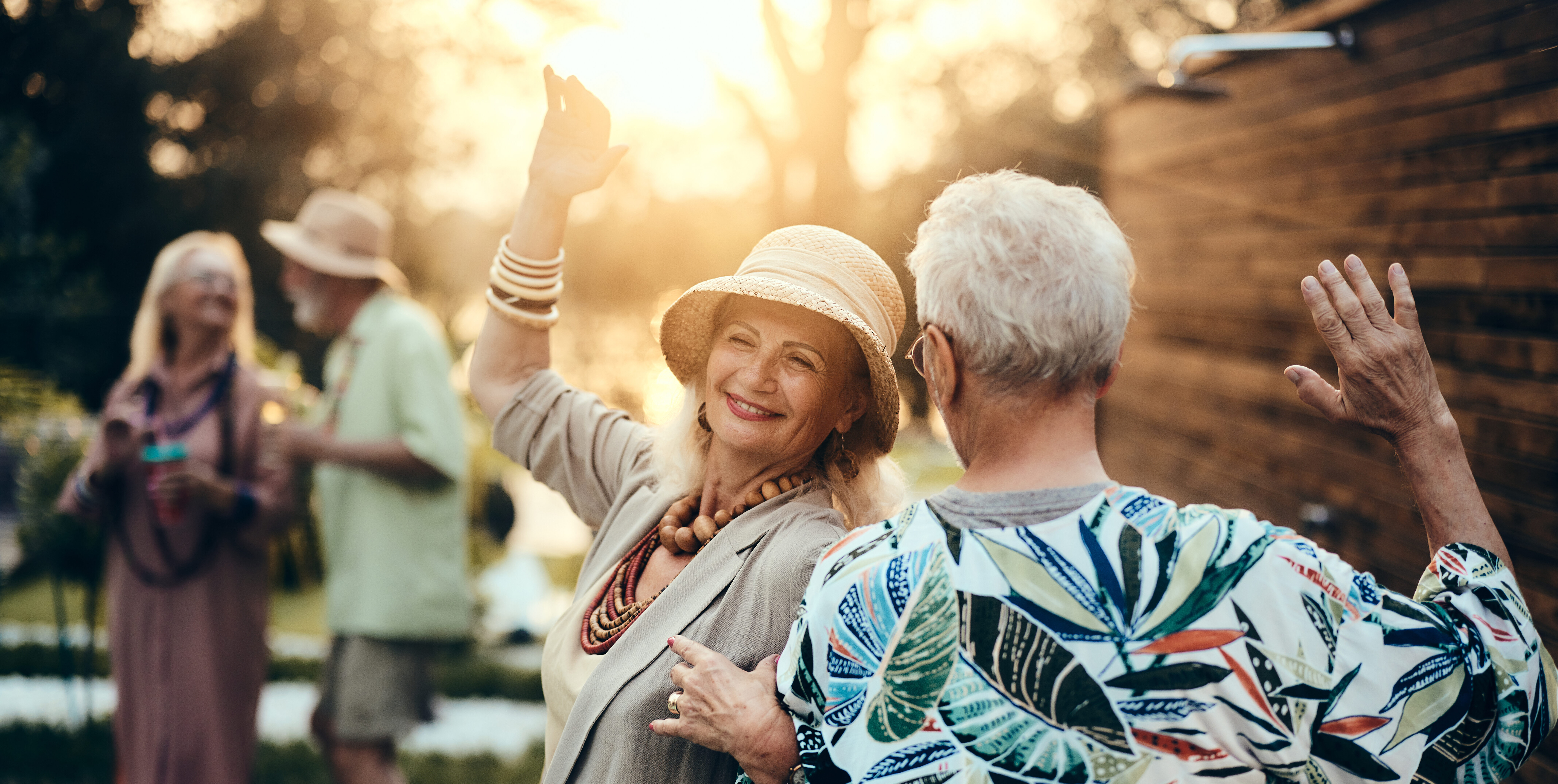 senior couple dancing together outside