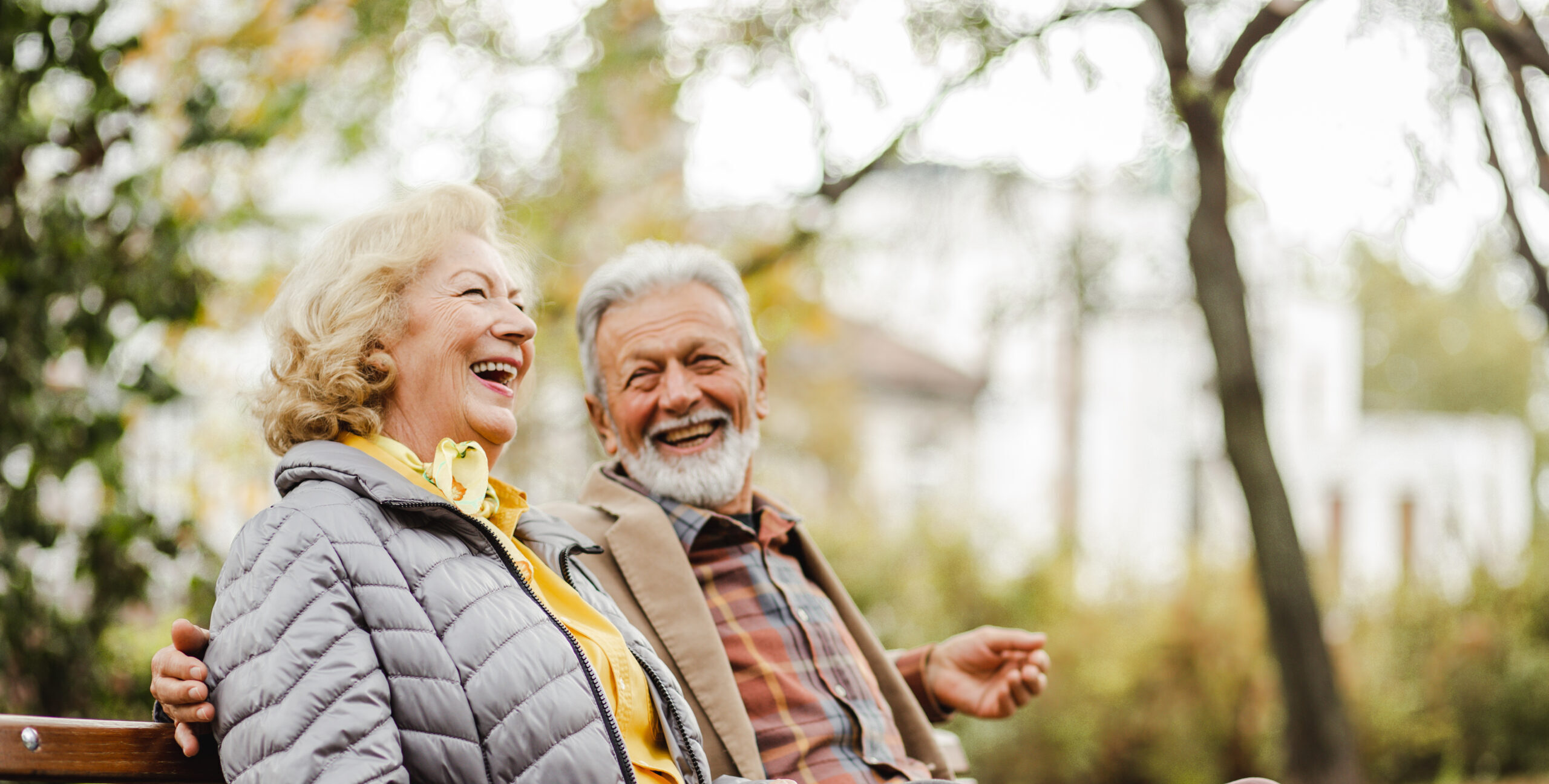 seniors sitting together on a bench