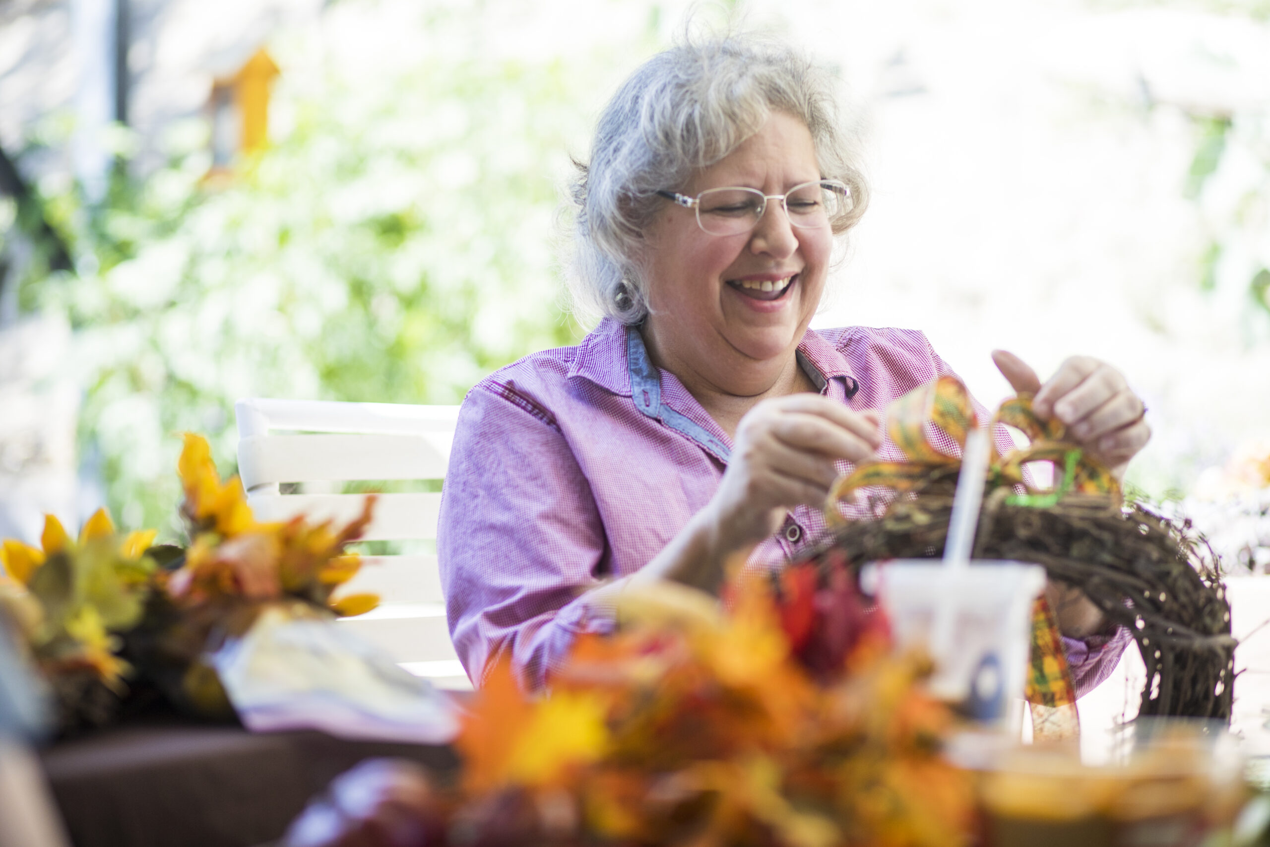 Senior women crafting and having a good time together