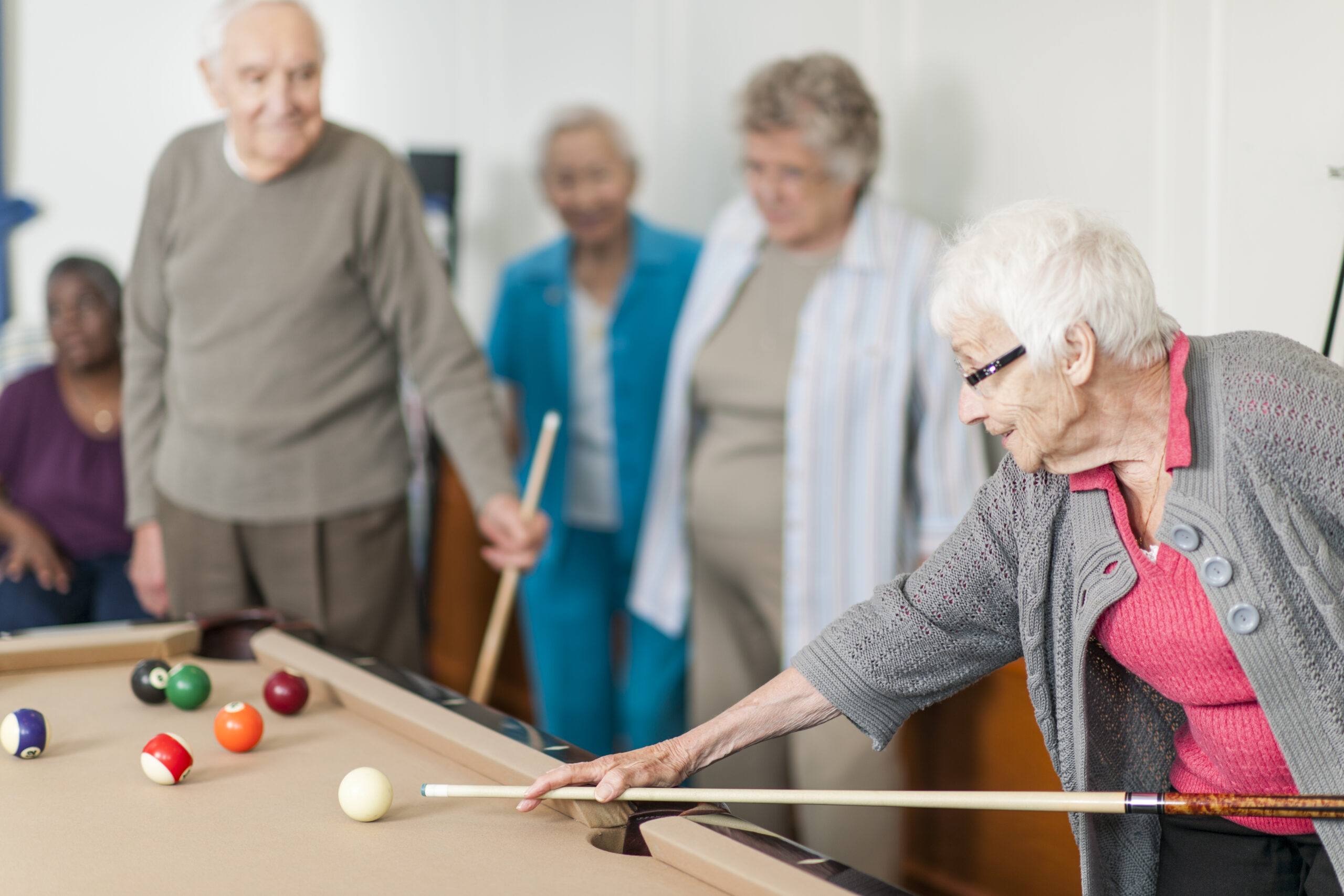 seniors playing pool