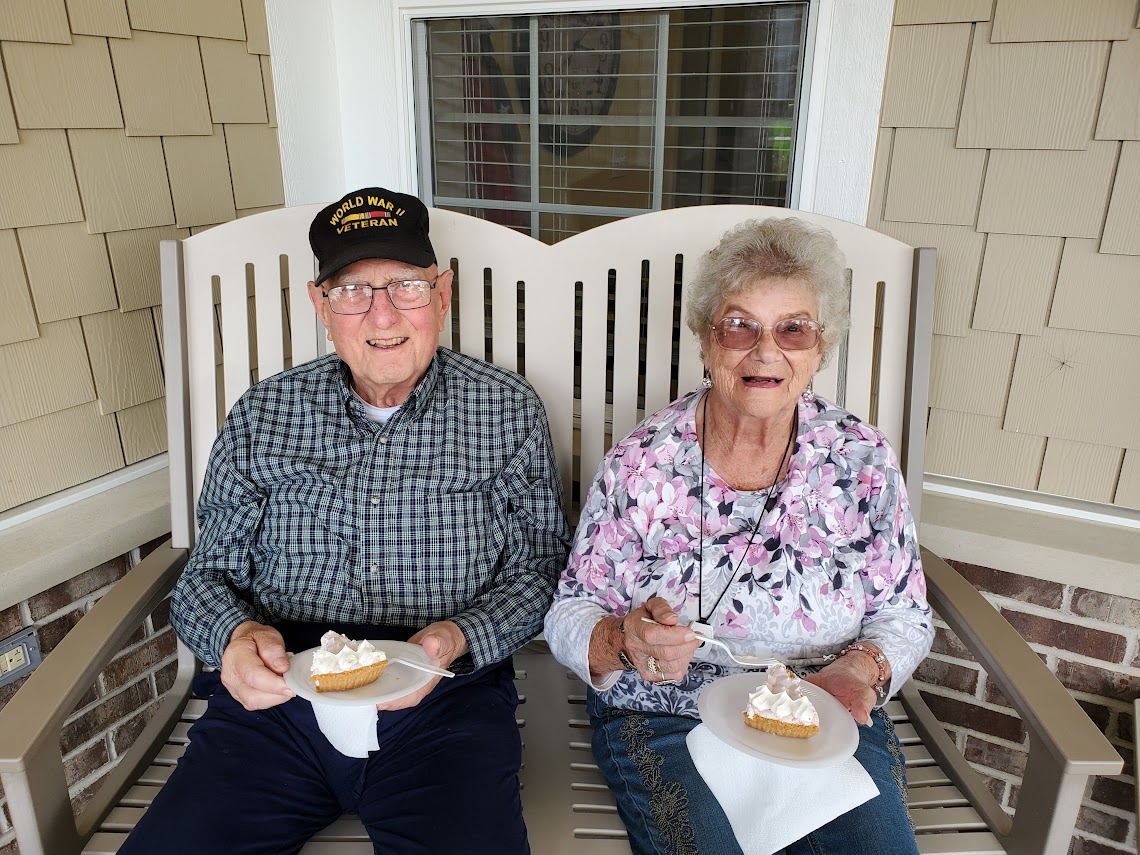 Two residents sitting together outside