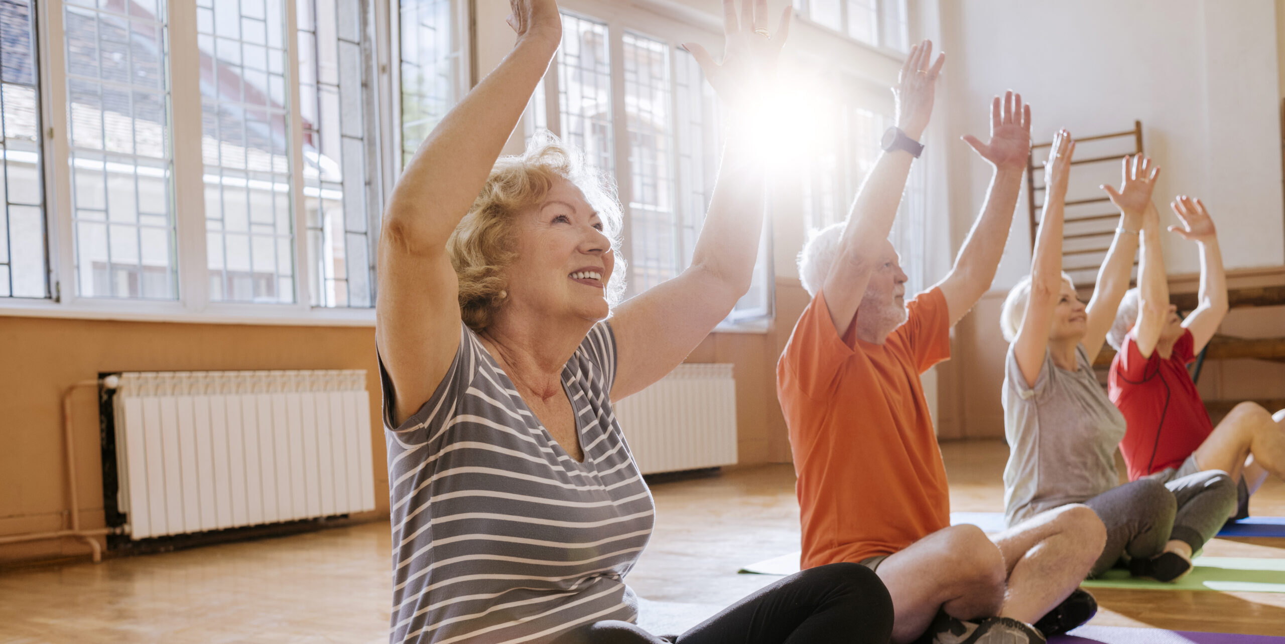 group of cheerful seniors having fun together exercising