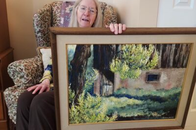 Resident Barbara Brasko with her painting