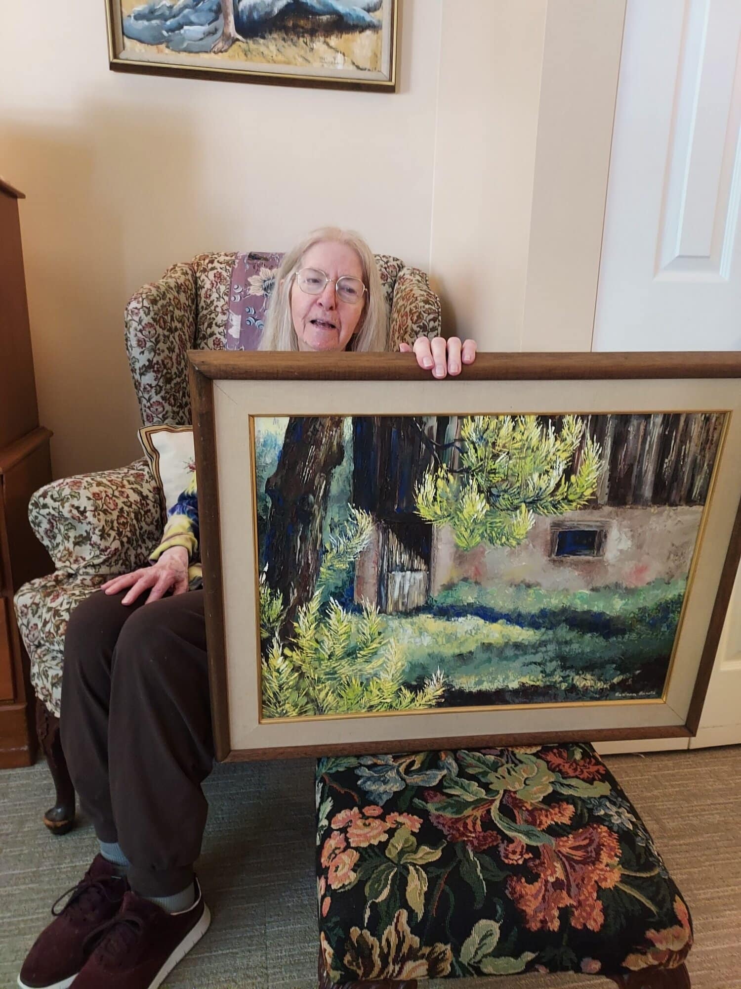 Resident Barbara Brasko with her painting
