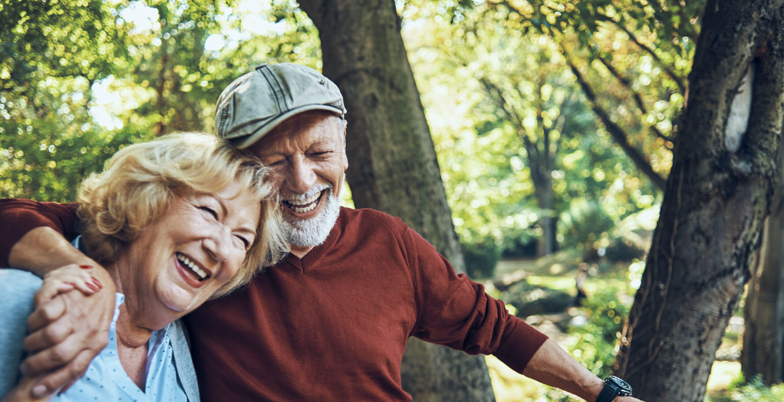 cheerful senior couple going to picnic