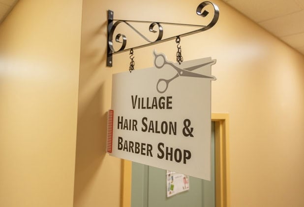 village hair salon and barber shop sign