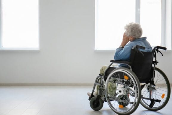 senior woman in wheelchair alone
