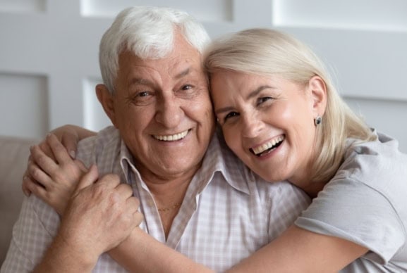 senior father hugging his daughter