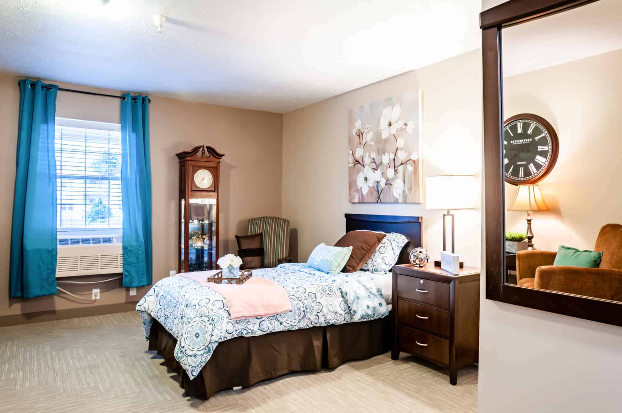 apartment bedroom with a bed and nightstand