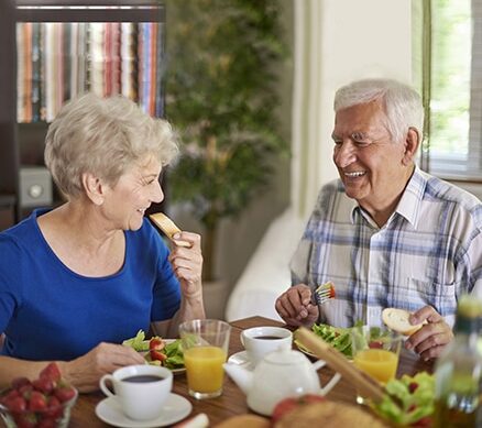 senior couple dining together and smiling