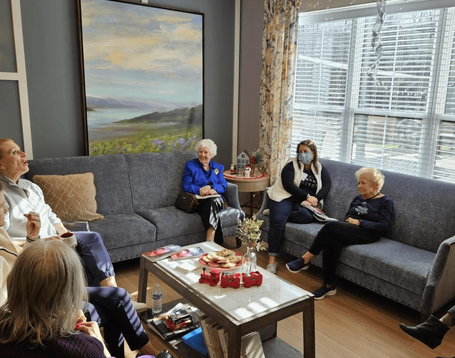 female senior residents sitting on the couch talking