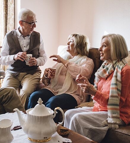 group of seniors conversing over tea