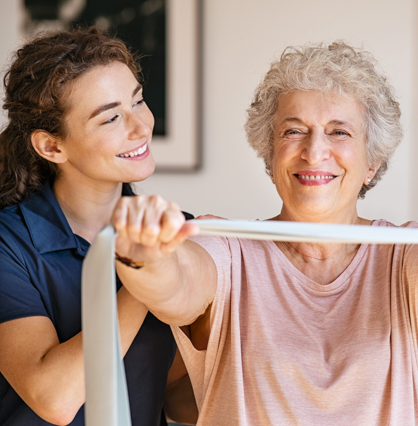 Personal Trainer helping senior with rehab