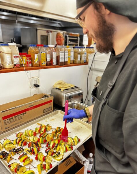 Chef crafting a vibrant, fresh dish