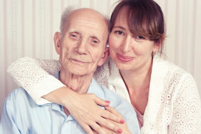Senior man with female caregiver