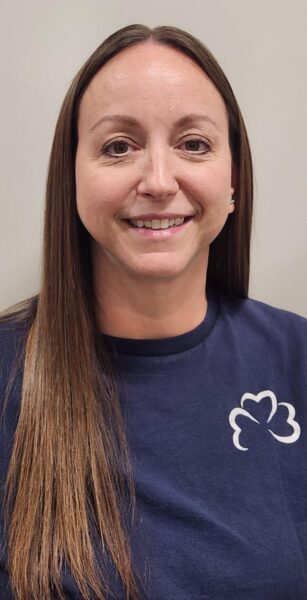 Young lady in a blue shirt smiling