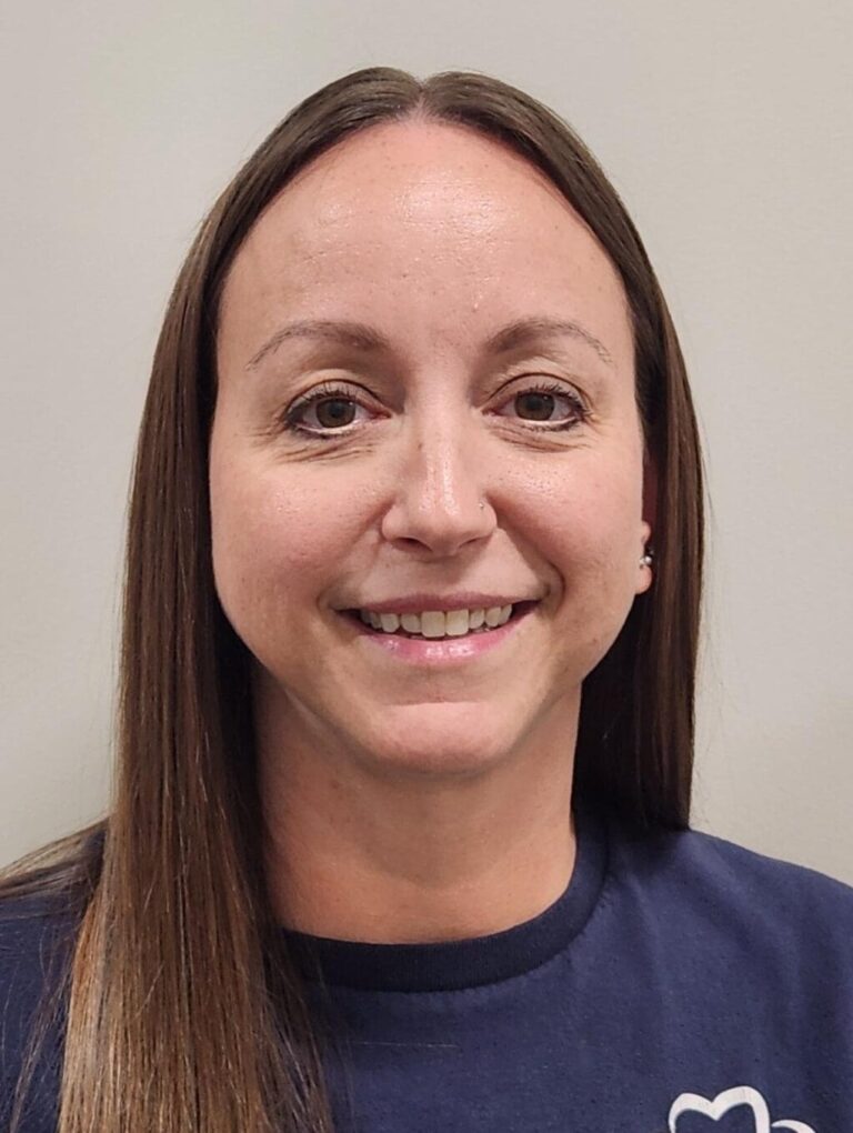 Young lady in a blue shirt smiling