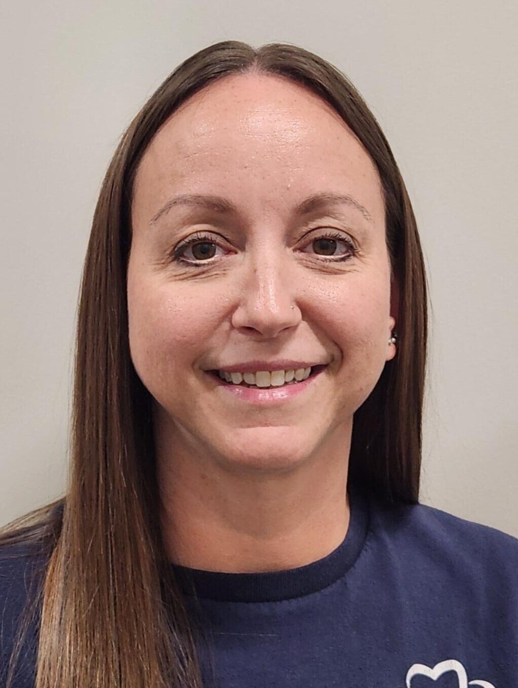 Young lady in a blue shirt smiling