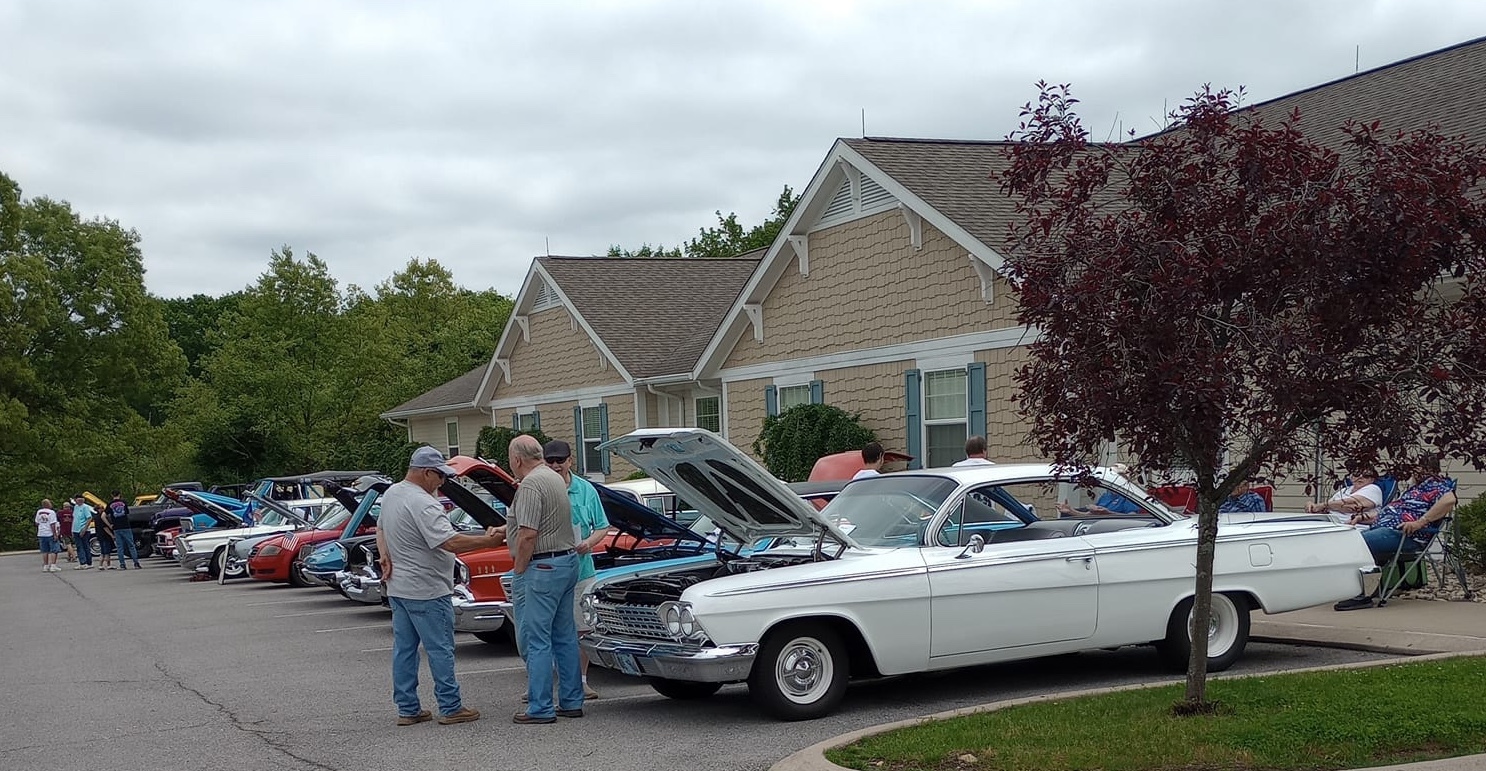 Cars and visitors at the Leaonard Street Car and Bike Show 2025 at Colonial Courtyard at Cleafield
