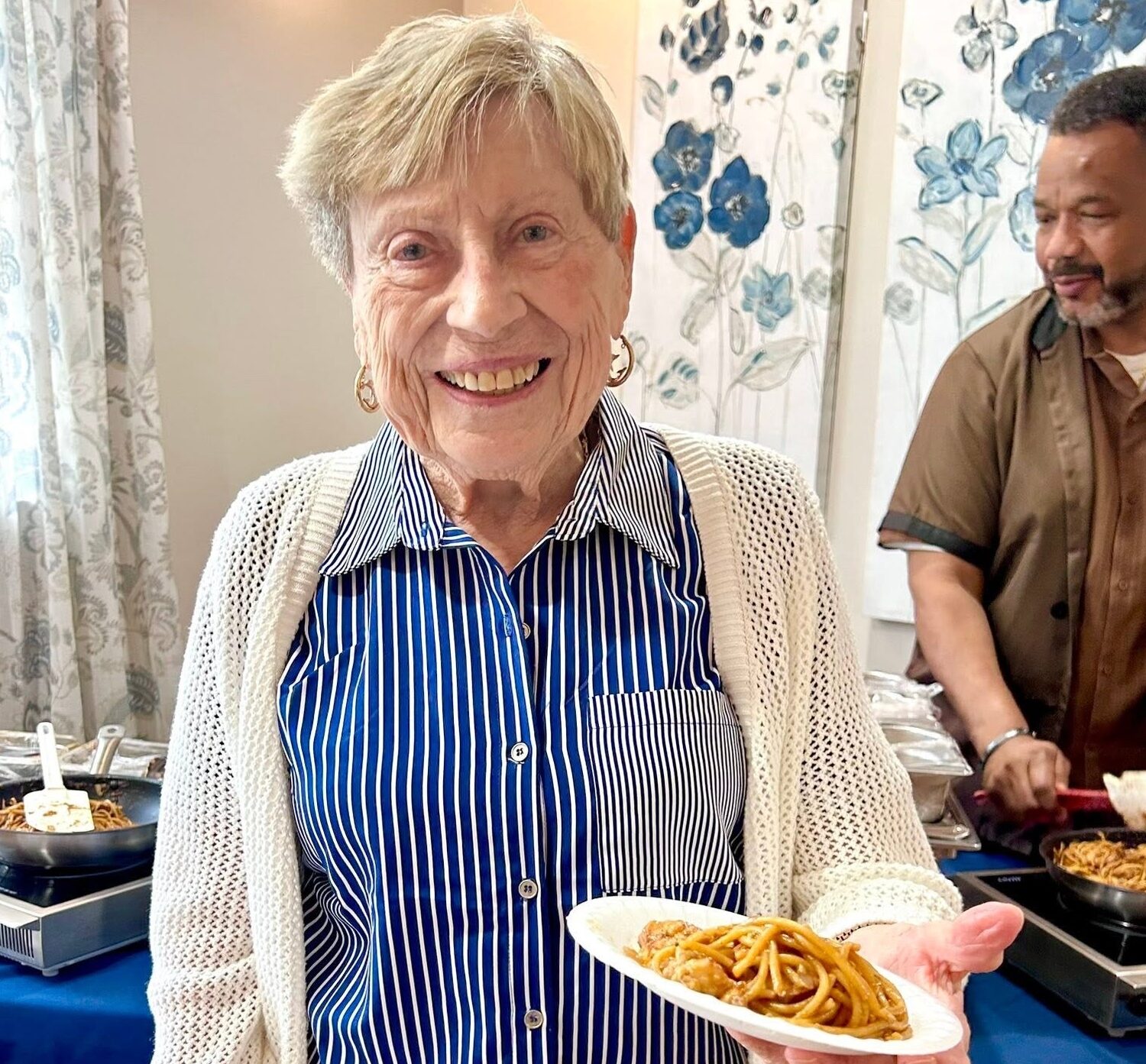Christine Patchell of Exton Senior Living holding dinner plate